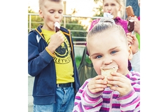 Image Young children eating ice cream.